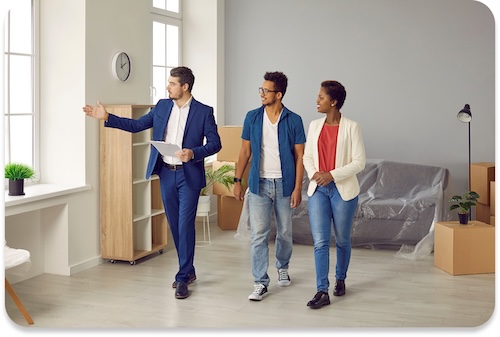 Couple touring a rental property with a real estate agent